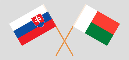 Crossed flags of Madagascar and Slovakia