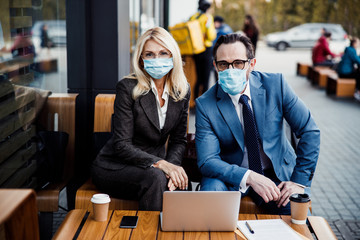 Entrepreneurs sitting at a business meeting outdoors