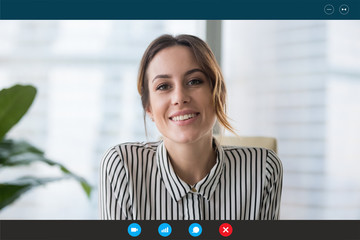 Pc screen view, head shot portrait businesswoman makes videocall looks at webcam consult client distantly, confident business lady lead job interview communicates with applicant by video telephony app - obrazy, fototapety, plakaty