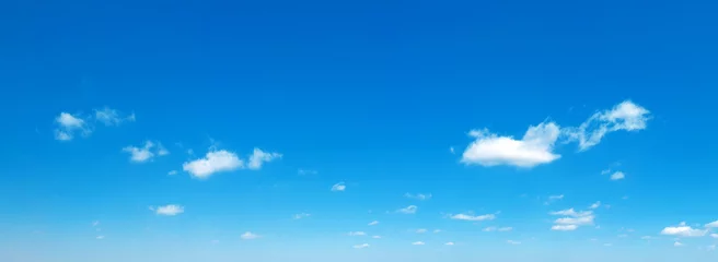 Deurstickers Blue sky background. Natural background. Panorama sky with tiny clouds © Pakhnyushchyy