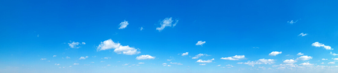 Fototapeta premium Blue Sky background with tiny Clouds. Panorama background