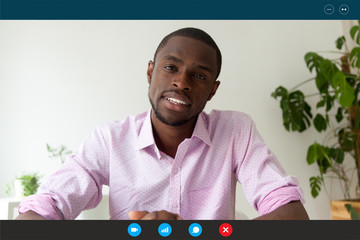 Computer screen webcam view African man pass job interview distantly by videoconference app....