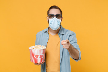 Man in 3d glasses sterile face mask isolated on yellow background. Epidemic pandemic coronavirus...