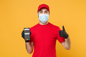 Delivery man in red cap blank t-shirt sterile mask gloves isolated on yellow background studio Guy...