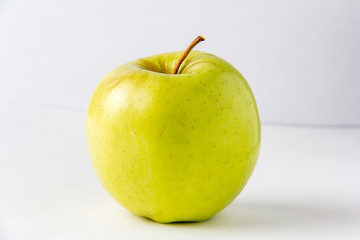 Fresh green apple on a white background. Juicy fruit