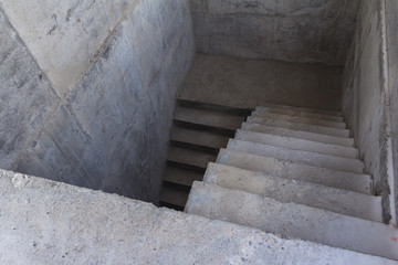 Concrete staircase to the basement of the building. Stairs down