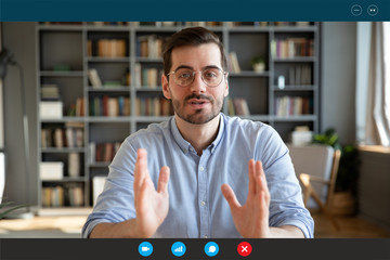 Businessman participate at virtual distant negotiations with colleagues via teleconference. Talk with clients provide information strategizing remotely. Video call self-isolation during ncov situation - obrazy, fototapety, plakaty