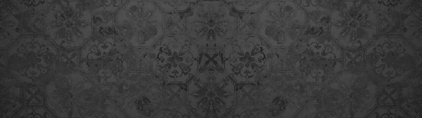 Old black anthracite vintage shabby patchwork motif tiles stone concrete cement wall texture...