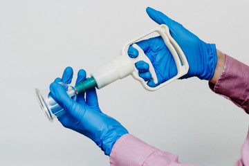 Vacuum pumps and jars for hijama. Arms. On a white background