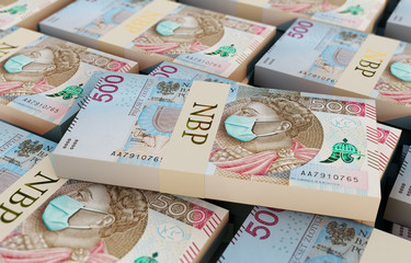 Coronavirus in Poland. Quarantine and global recession. 500 Polish zloty banknote with face mask against infection. Global economy hit by covid19.National Bank of Poland prints money