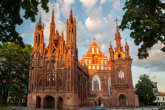 Catholic church of St. Anne a-  majestic sunset   landscape on city Vilnius and  green trees 