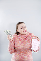 Middle age woman on white background. People try to buy medical masks during the quarantine period for any money. The concept of speculation in the market of necessary products. Covid epidemic