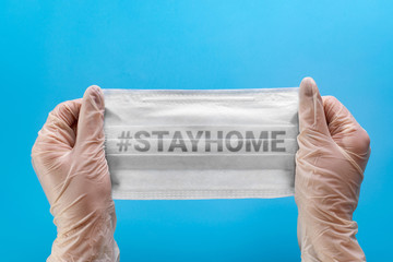 Protective medical face mask in the hands of a medic. Mask for protection against influenza,...