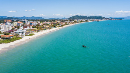 Naklejka na ściany i meble Aerial view of Bom Jesus watherfall beach (Praia cachoeiro de Bom Jesus) in Florianópolis, Santa Catarina
