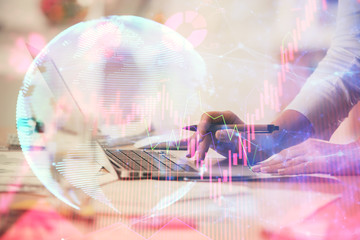 Double exposure of woman hands typing on computer and business theme hologram drawing. Success...