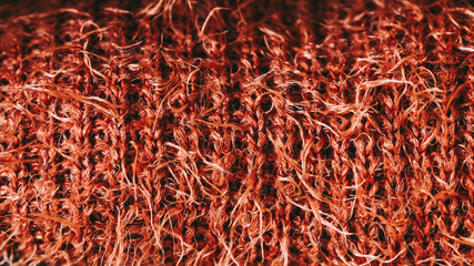 Fototapeta premium Gros plan sur un tricot de laine duveteux couleur brique