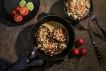 beef chops in a pan on the background