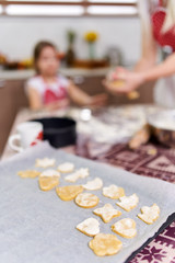 Girl making gingerbread cookies