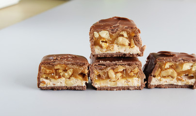 chocolate candy bar with peanuts and nougat