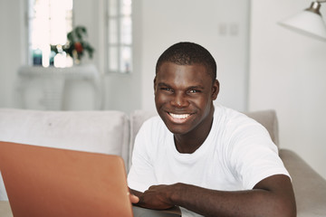 portrait of a man sitting on a sofa
