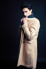 Obraz premium handsome asian fashion looking man posing in studio on black background, lifestyle modern people concept