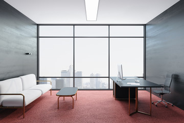 Modern office with computer and panoramic city view.