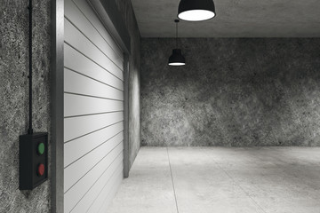 Concrete warehouse interior with lamps on ceiling