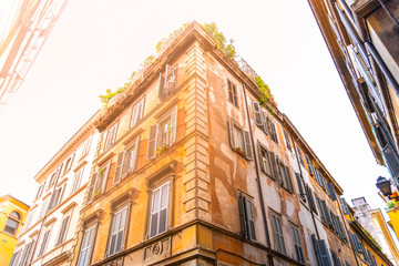 Fototapeta na wymiar Residential houses of Rome. Old town buildings. Street view. Rome, Italy