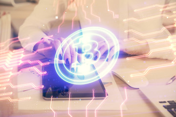 Double exposure of blockchain business sketch hologram and woman holding and using a mobile device.