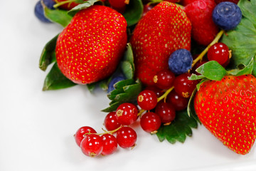 Fototapeta na wymiar assorted fresh berries on a white background