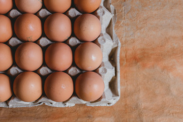 Eggs in carton box on rustic background, bogota colombia, april 4, 2020