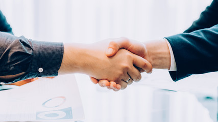 Professional cooperation. Closeup of hand shake. Cropped shot of business partners closing deal.