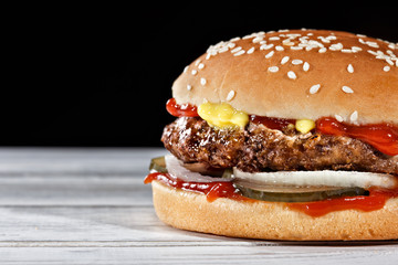 The mustard-mind meaty and juicy beef burger with the classic pickles and ketchup best options for home delivery.