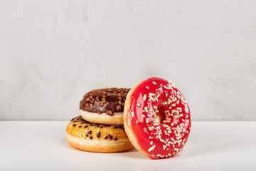 Freshly home made delicious donuts with variety of flavors straberry, chocolate and honey glazed coated with peanuts and sprinkles. Perfect for home delivery and recommended for food menu content.