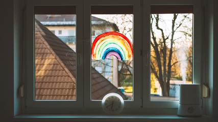 Close-up photo of painting rainbow on window