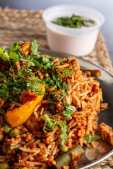 A view of an Indian dish called Tawa Pulao, in a restaurant or kitchen setting.