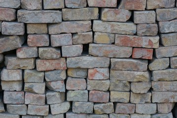 gray brown stone texture from an old and dirty brick wall 