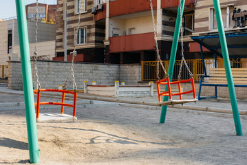 Fototapeta na wymiar An empty children's Playground in Sunny weather during the pandemic. Stay at home