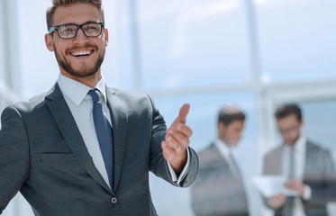 smiling businessman welcome handshake