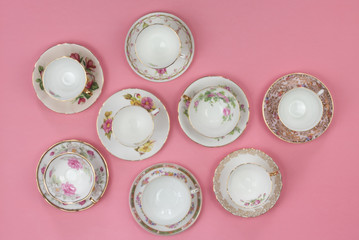 Pretty vintage floral teacups on pink background