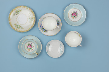 Pretty vintage china teacups on bue background