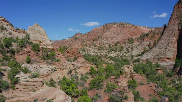 Aerial video pushing in on a desert rocky landscape shot in cinema 4k