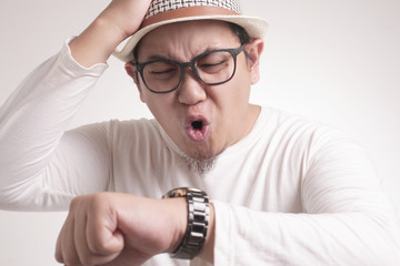 Asian Man Worried by Time, Work or School Deadline Stress
