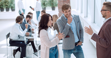 group of business people discussing something standing in the of