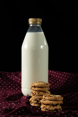 cookies and milk with black background