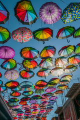 Fototapeta na wymiar Colorful umbrellas on blue sky