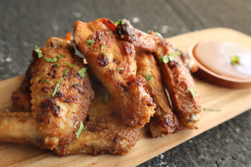 Delicious chicken wings, baked or fried chicken wings served with hot spicy  barbeque sauce