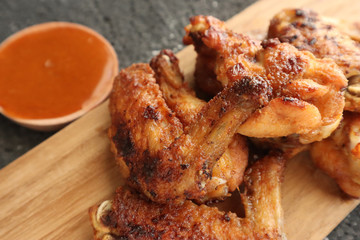 Delicious chicken wings, baked or fried chicken wings served with hot spicy  barbeque sauce
