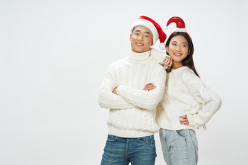 happy couple in christmas hats