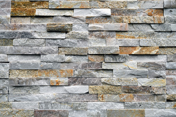 Rough stone wall background of rural buildings